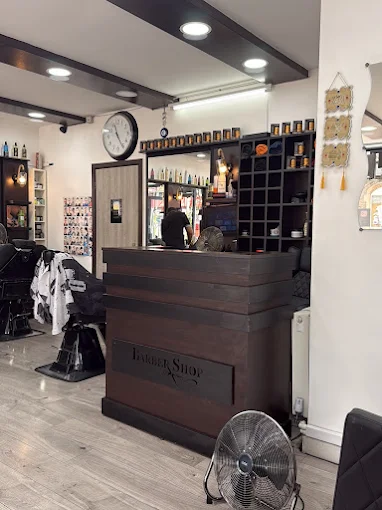 Inside A-Z Barbers, chairs and mirrors